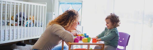 A parent and child playing